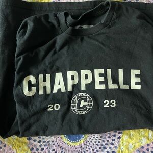 Dave Chapelle shirt.